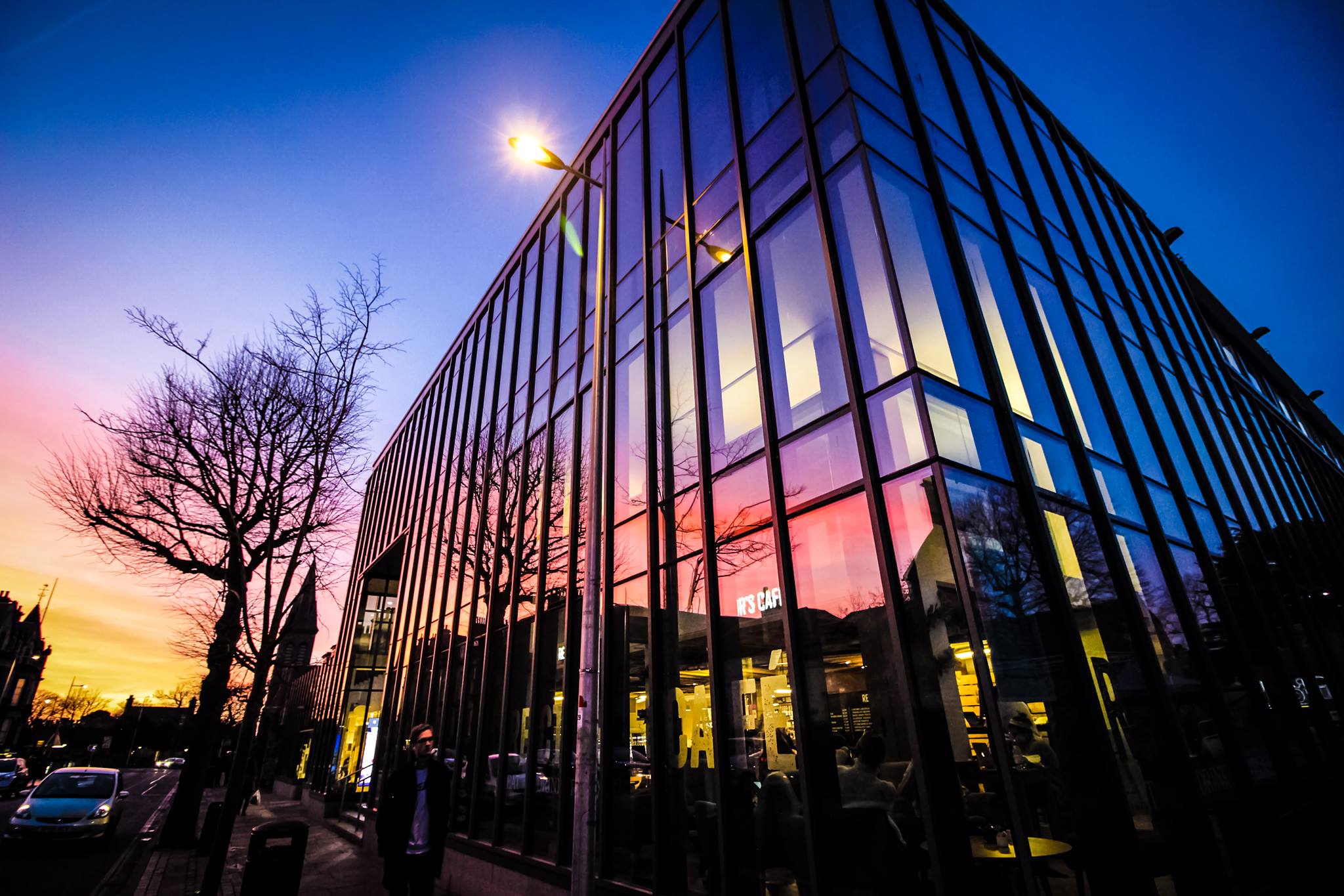 Outside view of the Union with the sunset reflecting in the windows